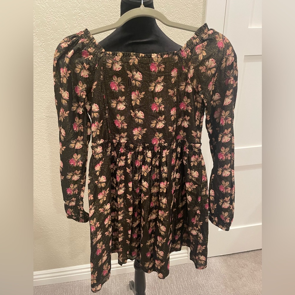 Girls Gap back dress with metallic thread and flower detail.